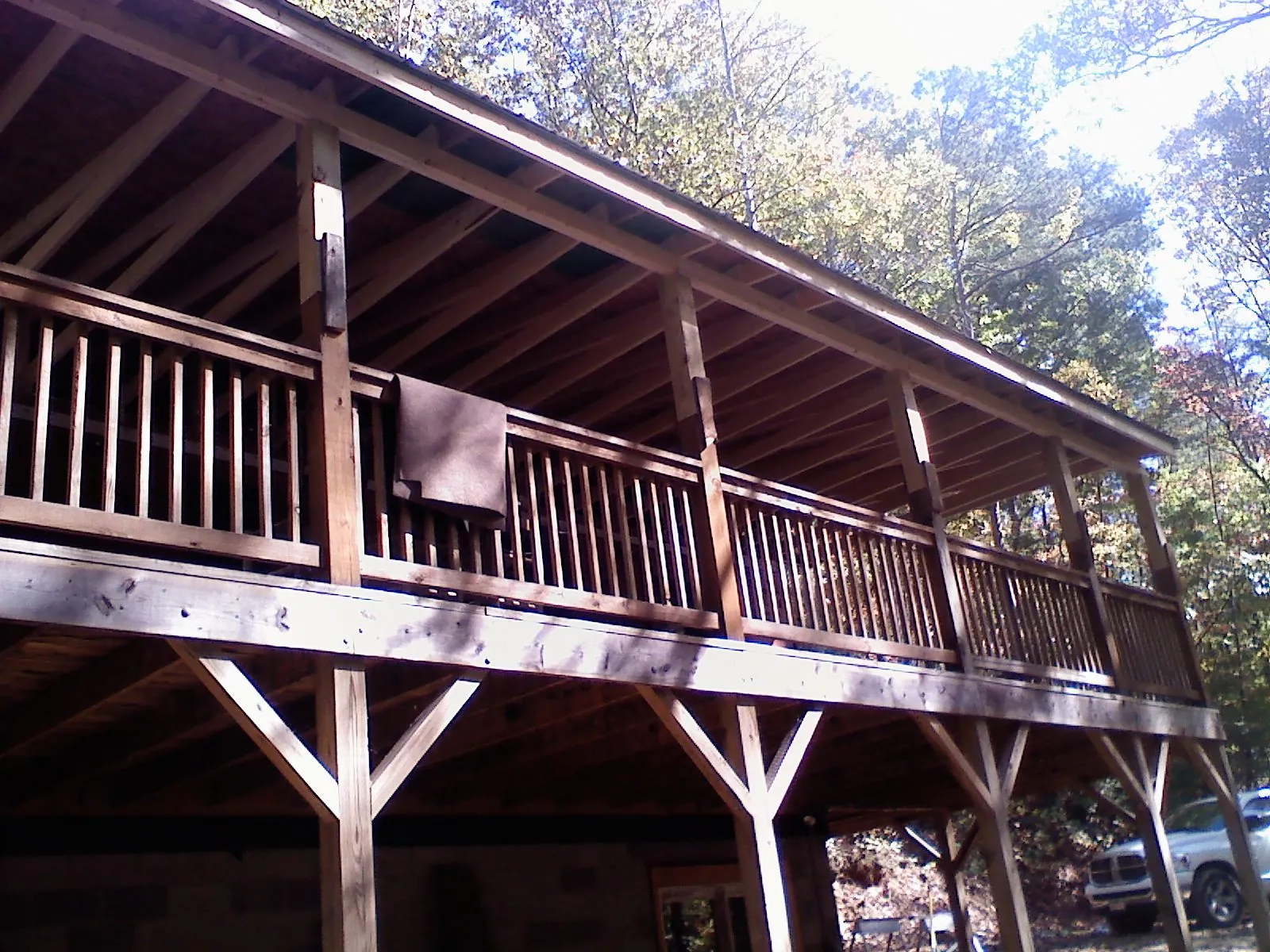 Timber framing under a new elevated porch and deck — Roof Leak Repair in Newton Highlands by Roofing Brothers